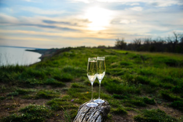 
champagne glasses at sunset