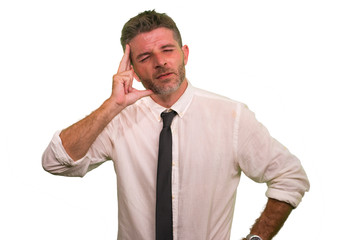 young attractive tired and stressed businessman in shirt and tie suffering stress and headache dealing with business and financial problems at office isolated on white background