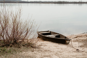 Fototapeta premium Old fishing boats on the background of the river. Landscape with boats. Old boats 