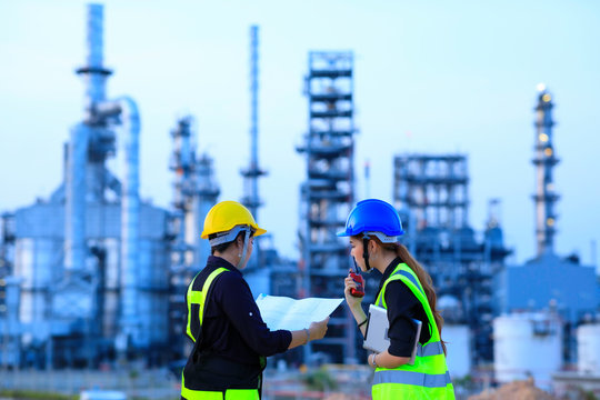 Smart two female engineer discussion together at refinery industry plant at industry factory center area. Engineering Concept