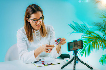 Telehealth – Medical doctor recording video instructions for patient and  demonstrating how to...