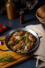 Homemade white sausage fried with onion and herbs