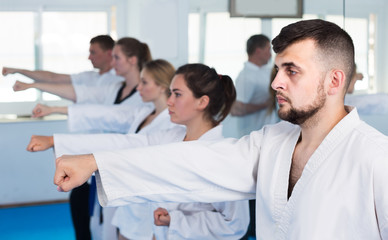 Fototapeta premium trainees expressing interest in attending karate class