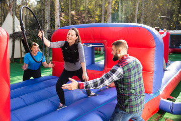 Woman playing tug of war with hoop