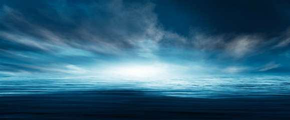 Obraz premium Night seascape. Dark landscape with a marine background and sunset, moon. Abstract night landscape in blue light. Reflection of the moon in the night water. Empty futuristic landscape.