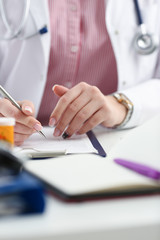 Female medicine doctor hand hold jar of pills