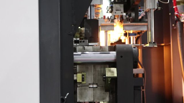 Manufacturing of  plastic bottle by hot blow injection process