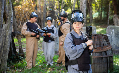 Woman and her paintball sport team