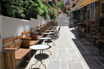 Athens, Greece, May 6 2020 - Empty cafe-restaurant during the Coronavirus lockdown.