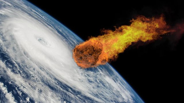 Meteorite Falling to Earth with a Hurricane. Asteroid, comet, meteorite glows, enters the earth's atmosphere. Attack of the meteorite. End of the world. Elements of this image furnished by NASA