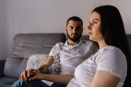 Couple Dreaming To Be Parents. Upset Man Comforting His Depressed Wife With Negative Pregnancy Test, Free Space