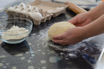 Woman hands preparing dough