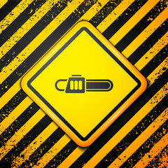 Black Chainsaw icon isolated on yellow background. Warning sign. Vector Illustration