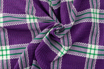 purple bright checkered thin dish towel in the kitchen