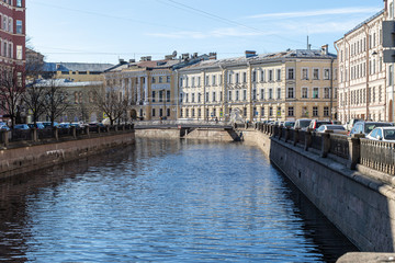 buildings on the embankment are reflected in the water