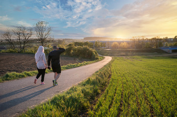 Muslim couple walking on a road
