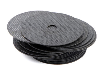 A pile of Black Circular Thin cutting disk for industrial Iron , metal , Steel work isolate on white background.