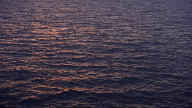 Beautiful sea sunset. Small waves on the high seas during a beautiful sunset. Rema for relaxation.