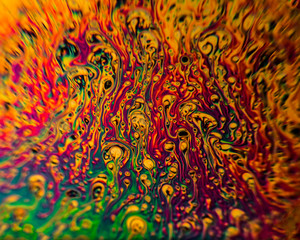 This is a picture of soap bubbles taken in a black coffee mug. The microscopic look of the bubbles is achived by using a lens from a rear projection TV as a macro filter lens. Suitable as a background