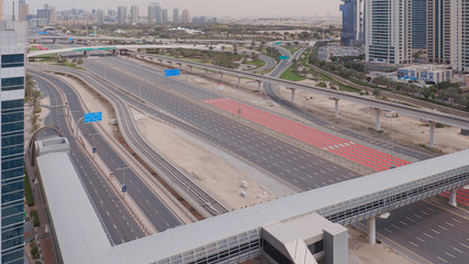 Aerial view of empty highway and interchange without cars in Dubai