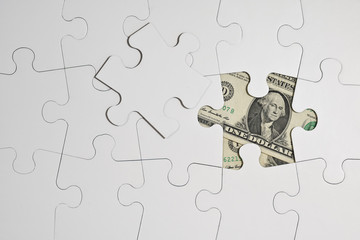 Puzzle casse tete complication piece assemblage argent finances dollar