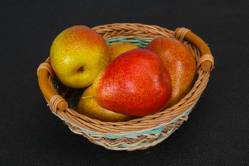 Pear heap in the wooden basket