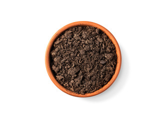 clay pot filled with organic potting soil