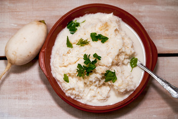 Grated radish porridge with parsley