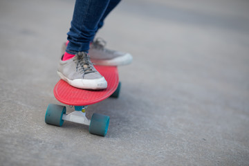 Skateboarder legs skateboarding at outdoors