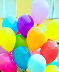 A lot of balloons on the background of the school. September 1. Last call. Graduates. Education. Holiday. Childhood. Last bell festival for parents.  Modern school.