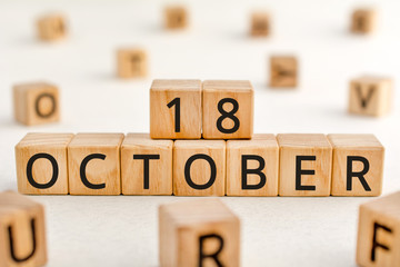 October 18 - from wooden blocks with letters, important date concept, white background random...