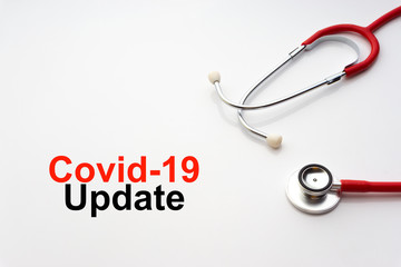 COVID-19 UPDATE text with stethoscope on white background. Covid or Coronavirus Concept