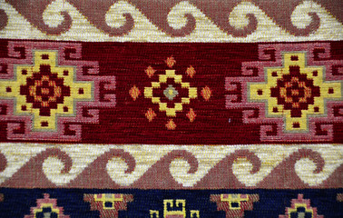 Fototapeta na wymiar Traditional authentic motifs and symbols on carpet.