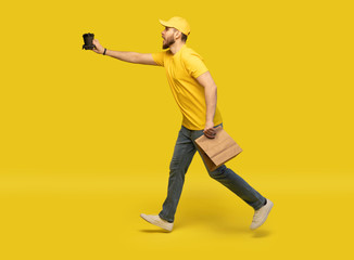 delivery service, fast food and people concept - happy man with coffee and disposable paper bag