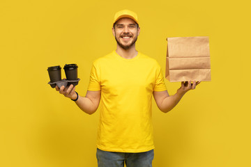 delivery service, fast food and people concept - happy man with coffee and disposable paper bag