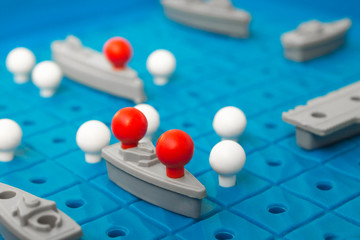 Battleship, board game. Sea battle. Toy ships on a plastic board. Perfect hit. Victory or defeat....