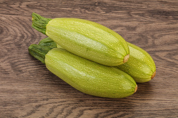 Young tasty zucchini over board