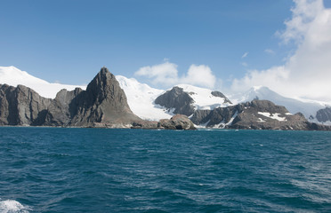 Antarctica landscape with ocean and mountains on a clear winter day