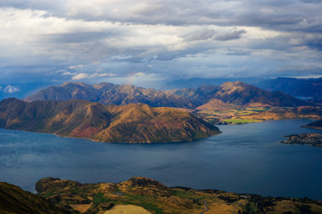 View of Mountains and Lake from Roys Peak trail on a cloudy evening