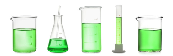Set of laboratory glassware with green liquid on white background. Banner design