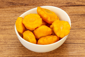 Marinated yellow patisson in the bowl