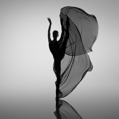 Ballerina dancing with black cloth