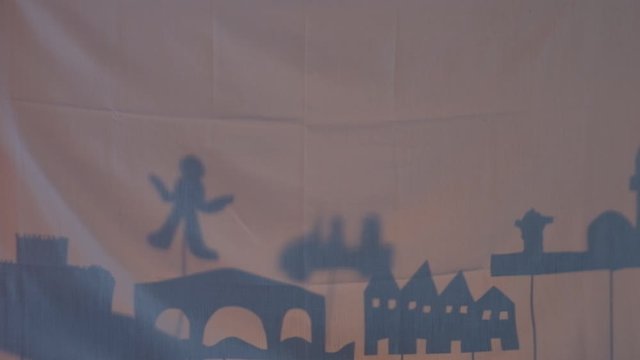 Home-made DIY shadow theater depicting the story of the start of WWII in Sarajevo by assassination of Franz Ferdinand. Creative fun at home with simple tools. Creative workshop learning, storytelling.