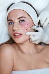 Skincare Face Treatment. Anti Aging Injection Beauty Procedure In Cosmetic Clinic For Female. Beautician Hands In Gloves With Syringe.