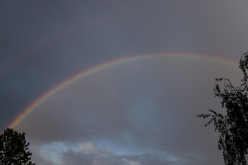 Rainbow in stormy sky