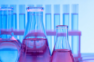 Close-up of glass test tubes and other laboratory glassware