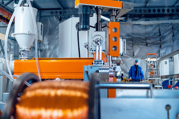 Production of copper wire, cable in reels at factory. Cable factory. Close up.