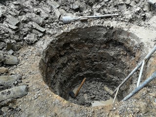 deep and big hole and old stair dig by hand of worker