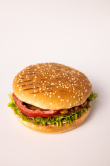 Burger with vegetables and meat on the white background isolated