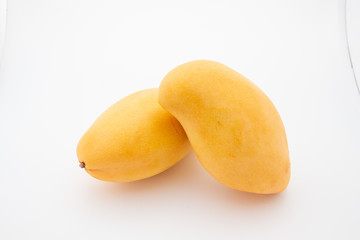 Close up one ripe yellow mango popular of fruit slices product isolated mockup on white background concept for summer tropical juice taste breakfast image. Eating fresh healthy organic food.